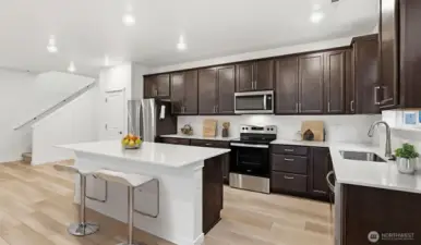 Designed for both cooking and conversation — virtually staged to show function and livability.