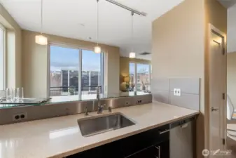 Stunning kitchen with breakfast bar, stainless appliances, stone counters and plenty of storage.