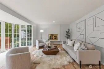 Family room has cozy wood-burning fireplace.