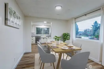 Lovely dedicated dining area between the kitchen and living room. *this photo has been virtually staged*