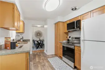 Plenty of room for storage in the multiple cupboards! The kitchen also features new flooring.