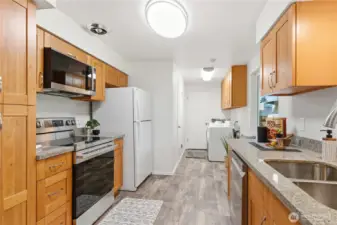 At the end of the kitchen is a door into the garages, the laundry area, and a storage closet.