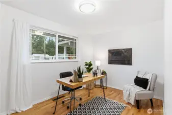 This third bedroom has been staged as a home office. It also looks out over the front yard.