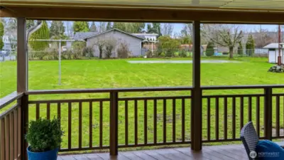 Enjoy a view of a backyard soccer game from the covered deck! Or imagine your garden space coming to life.