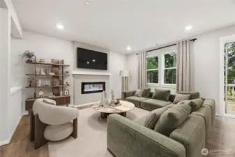 Family room with electric fireplace for those chilly nights. Picture for representational purposes only, colors and features may vary.