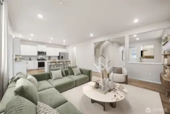 Family room is open to the island kitchen and the stairs to the fully finished basement. Picture for representational purposes only, colors and features may vary.