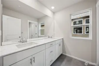 Upstairs hall bath with dual vanities and separate wet area. Picture for representational purposes only, colors and features may vary.