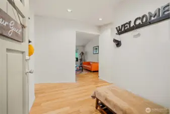 Bright entry with clean finishes and wood flooring, setting the tone for the home’s functional single-level layout and inviting living spaces.