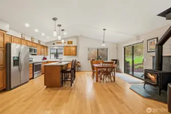 Open-concept kitchen, dining, and living areas create a seamless flow, ideal for everyday living and effortless entertaining.