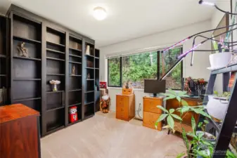 Third bedroom with a large window, bringing in natural light and a bright, open feel.