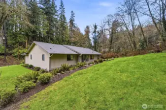 Back of home with spacious yard, highlighting the property’s rare Edmonds land value and usable outdoor space.