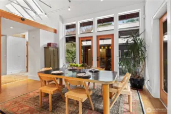 Doors open to the breezeway and patio, detached studio entrance