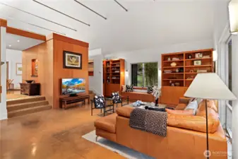 Steps on either side of the living room to the dining room or the kitchen