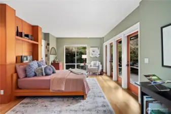 The primary en-suite is just off the living room, and looks out to the courtyard