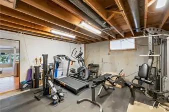Tons of dry storage abound, especially in this space behind the lower level kitchen! Ready for you to workout or create more storage options!