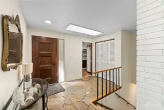 A flagstone entry and a big skylight greet your guests!  What unfolds around next corner is up to you!