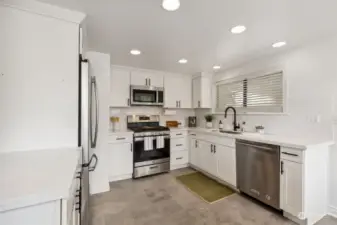 Updated modern kitchen with stainless steel appliances.