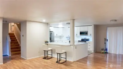 view of the kitchen from main living area and dining area