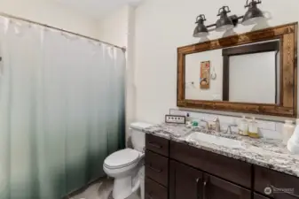 Main bath with tub and shower.