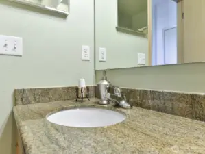 2nd bath has granite countertops. Granite backsplash.Lots of cabinets.
