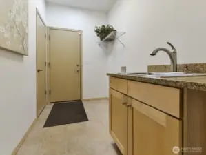 Utility room has extra closet for storage. Access from the garage.