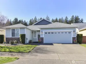 Wide driveway. Remotes for garage door/ Covered front porch. Cement paved gardens. HOA covers the yard mowing.