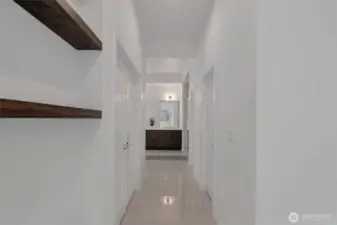 Hallway to primary bathroom and walk-in closet