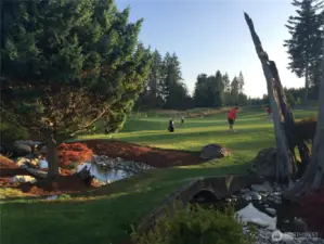 Practice on the putting green and chipping before golfing on the 18 hole golf course
