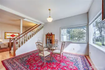 Notice the dining room views across the meadow to Port Townsend.