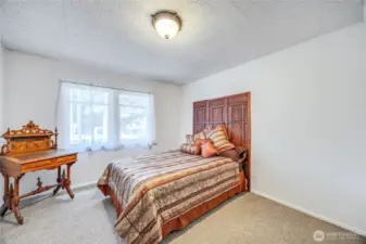 Main floor bedroom located just off the kitchen