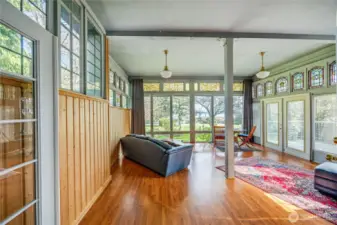 Sunroom with the 17 antique French and German stained-glass windows.