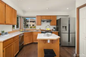 Kitchen with a dining nook and pantry storage