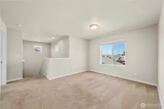 Loft bonus family room at the top of the stairs.