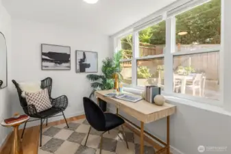 Main level bedroom/office overlooking large fenced yard