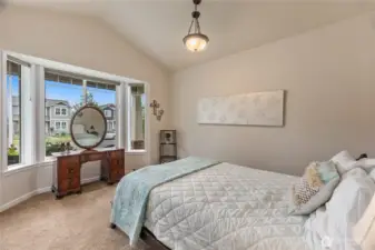 The front bedroom can also be used as an office and has a view of the covered front porch.