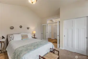 Double glass French doors and a transom over the entry provide natural light.  The vaulted ceilings create airiness.