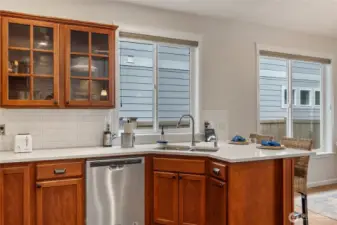 Even the clean up crew can remain part of the action in this thoughtfully designed kitchen.