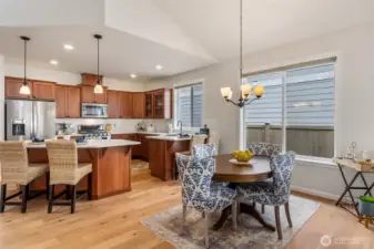 Tall ceilings with architectural detail add to the ambience of the kitchen/dining area.