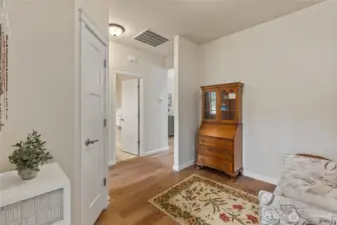 The main hallway opens to an ante-room and is a perfect spot to read or conduct personal correspondence.