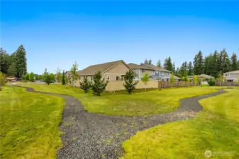 Paths and green space provide extra privacy for this lot.  There is open space to one side and at the rear of the lot making this a special place to call home.