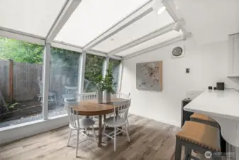 Large sunroom windows in dining room