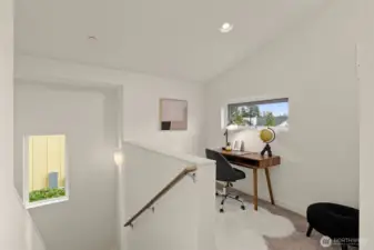 Vaulted ceilings make the dedicated workspace light and airy