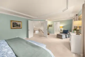 Primary retreat with expansive double doors and sophisticated crown molding