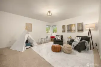 Expansive bonus/flex room with storage closet