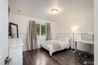 Other side of the house bedroom #2 with charming wainscoting.