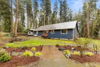 Sweet bridge over a rocked stream for added charm & character.