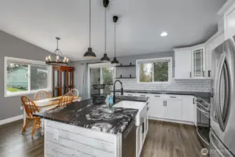 with farm style sink and custom granite counters