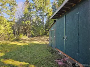Shed on the upper homesite is ready to hold your tools while you build.