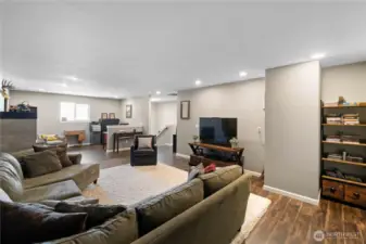 This rec room has it all Work space, plumbed for a wet bar, Plenty of space for a big screen TV.