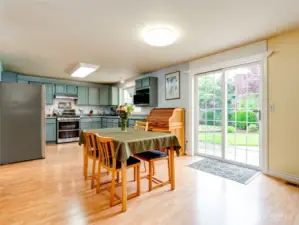 Kitchen eating area with gorgeous sliding doors to private outdoor space.